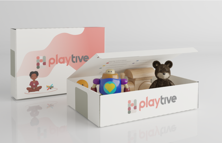 Visual of a box filled with toys and a closed upright box left behind it